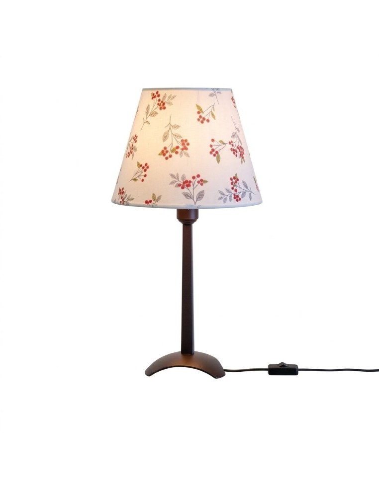 Ejemplo de lámpara con pie triángulo marrón y pantalla decorada con plantilla de bayas.