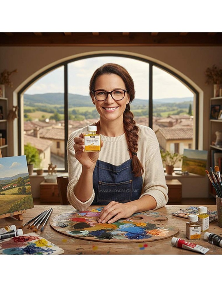 Artista utilizando aceite de linaza refinado Pebeo en su estudio para mezclar colores al oleo sobre una paleta.